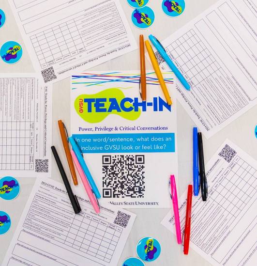 photo from above of papers and pens on a table top